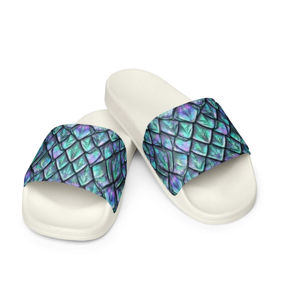 Seamless pattern of overlapping iridescent dragon scales in shimmering teal and purple.
