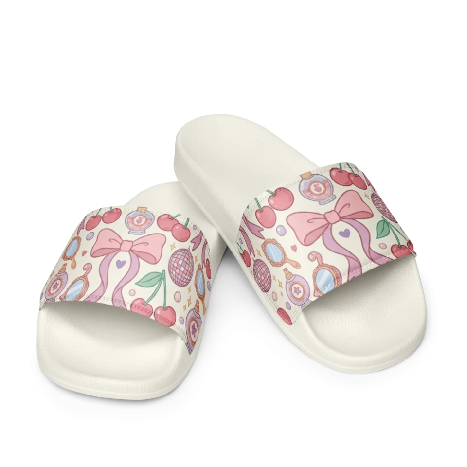 A seamless pastel pattern featuring pink bows, red cherries, perfume bottles, and hand mirrors.