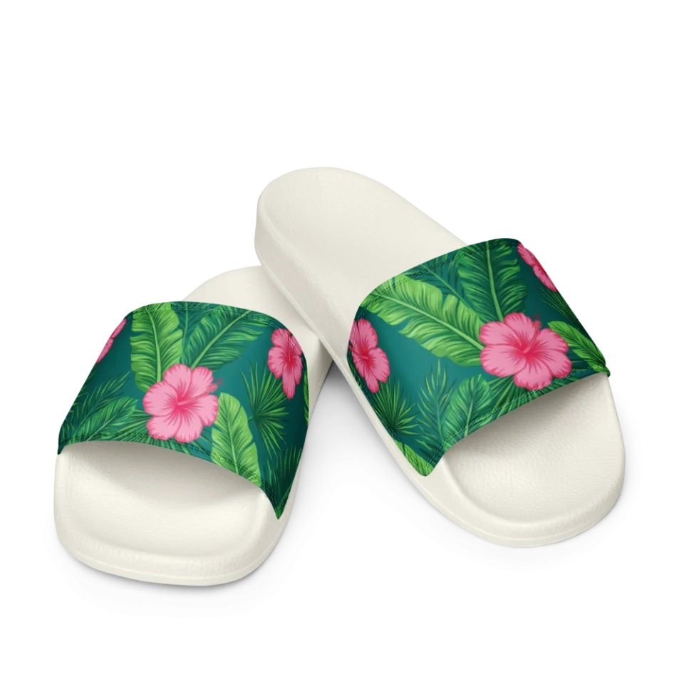 A seamless tropical pattern of pink hibiscus flowers and green palm leaves on a teal background.