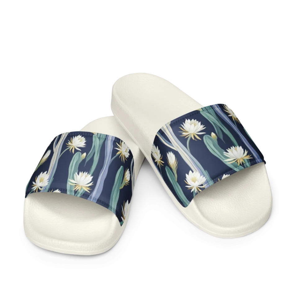 Seamless pattern of white night-blooming cereus flowers on green and blue stalks over navy.